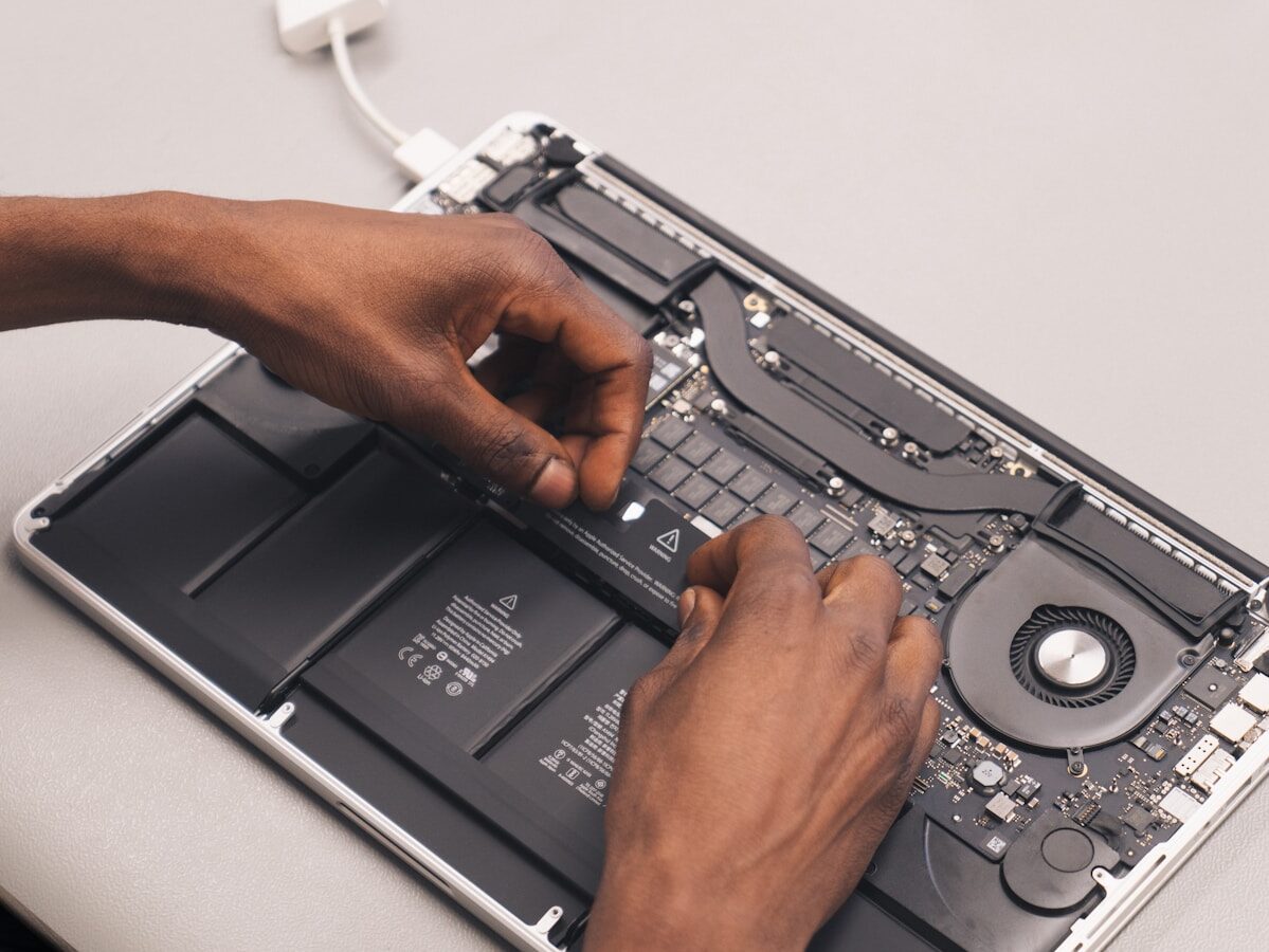 a person holding a laptop